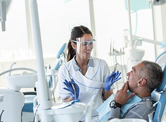 Dentist explaining treatment to patient