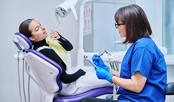 Teen girl talking to dental team member